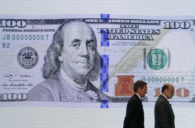 U.S. Treasury Secretary Timothy Geithner (L) and Federal Reserve Chairman Ben Bernanke leave a ceremony to debut the new design for the US$100 note at the Department of the Treasury in Washington, April 21, 2010. Officials from the U.S. Department of the Treasury, the Board of Governors of the Federal Reserve System and the United States Secret Service today unveiled the new design for the $100 note. Complete with advanced technology to combat counterfeiting, the new design for the $100 note retains the traditional look of U.S. currency.   REUTERS/Jim Young   (UNITED STATES - Tags: POLITICS BUSINESS)