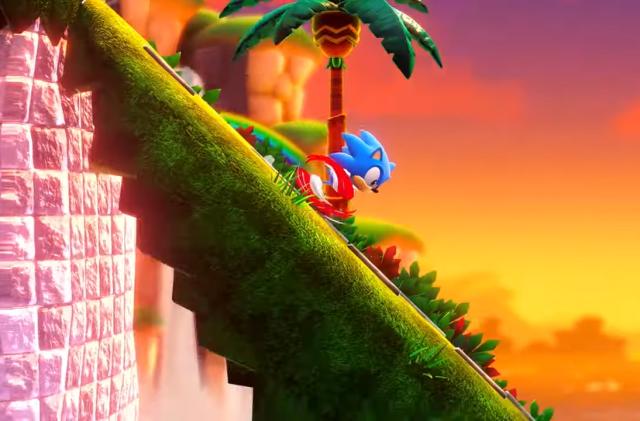 Gameplay screenshot of Sonic the Hedgehog running in the upcoming ‘Sonic Superstars.’ He's speeding down a hill in a lush green environment.