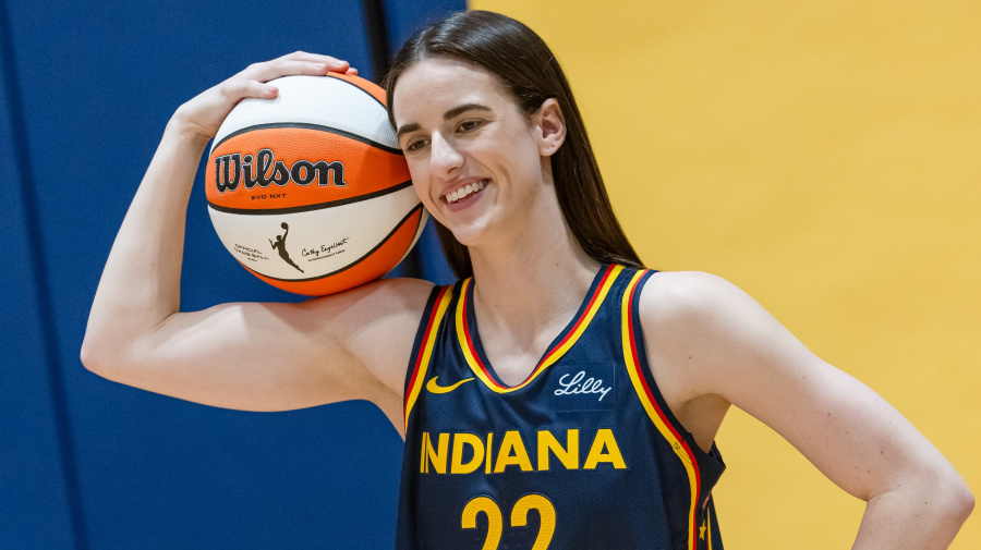 Getty Images - INDIANAPOLIS, INDIANA - MAY 1: Caitlin Clark #22 of the Indiana Fever poses for photographers during media day activities at Gainbridge Fieldhouse on May 1, 2024 in Indianapolis, Indiana. NOTE TO USER: User expressly acknowledges and agrees that, by downloading and or using this photograph, User is consenting to the terms and conditions of the Getty Images License Agreement.  (Photo by Michael Hickey/Getty Images)