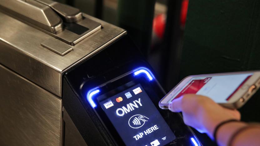 A customer uses a phone to pay for a New York City subway ride on the first day of operation of the OMNY (One Metro NY) contactless payment system in New York, U.S., May 31, 2019. REUTERS/Brendan McDermid