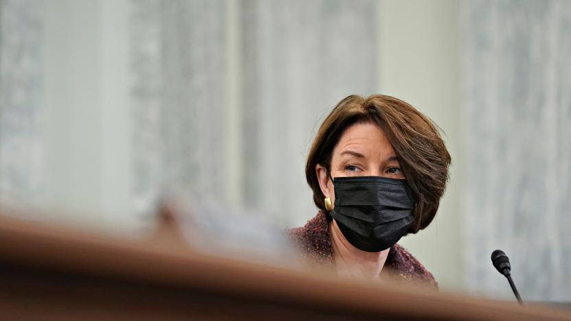 U.S. Senator Amy Klobuchar, a Democrat from Minnesota, wears a protective mask during a Senate Commerce, Science and Transportation Committee confirmation hearing for U.S. Secretary of Transportation nominee Pete Buttigieg in Washington, DC, U.S., January 21, 2021.  Stefani Reynolds/Pool via REUTERS