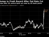 Gold Rises to Record After  Fed Makes First Rate Cut Since 2020