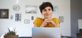 Woman sitting at laptop. (Getty Images)