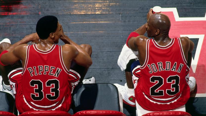 VANCOUVER, BC - JANUARY 27:  Scottie Pippen #33 and Michael Jordan #23 of the Chicago Bulls sit on the bench during the game against the Vancouver Grizzlies at General Motors Place on January 27, 1998 in Vancouver, British Columbia, Canada. NOTE TO USER: User expressly acknowledges and agrees that, by downloading and or using this photograph, User is consenting to the terms and conditions of the Getty Images License Agreement. Mandatory Copyright Notice: Copyright 1998 NBAE (Photo by Andy Hayt/NBAE via Getty Images)