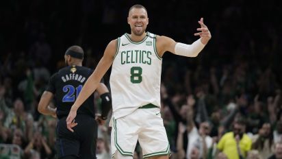 Associated Press - Boston Celtics center Kristaps Porzingis (8) celebrates a 3-pointer, near Dallas Mavericks center Daniel Gafford (21) during the first half of Game 1 of basketball's NBA Finals on Thursday, June 6, 2024, in Boston. (AP Photo/Charles Krupa)