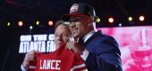 Trey Lance poses with NFL Commissioner Roger Goodell. (Getty Images)