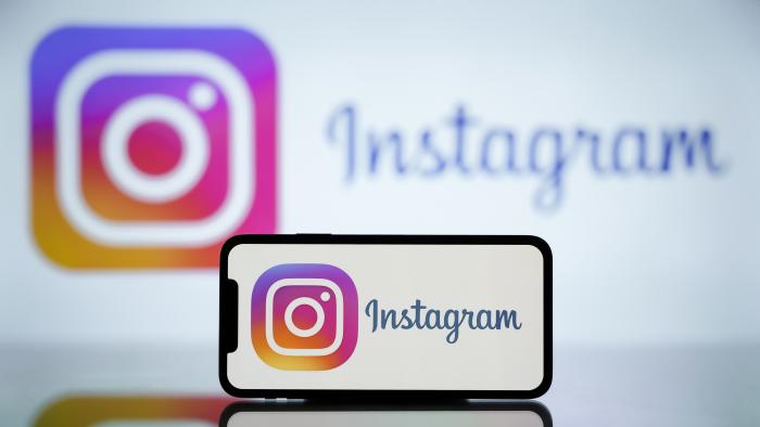 INDIA - 2024/04/27: In this photo illustration, the Instagram logo is seen displayed on a mobile phone screen and in the background. (Photo Illustration by Idrees Abbas/SOPA Images/LightRocket via Getty Images)