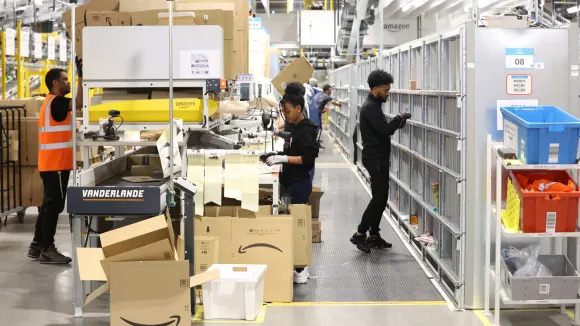 Amazon raises warehouse worker base pay to $22 an hour