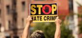 A person protests against hate crimes in California. (Getty Images)