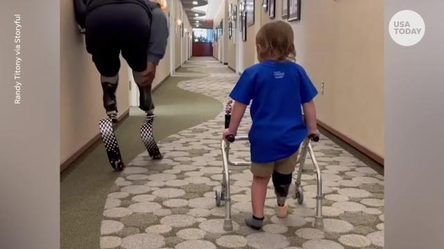 Toddler takes first steps next to a Paralympian