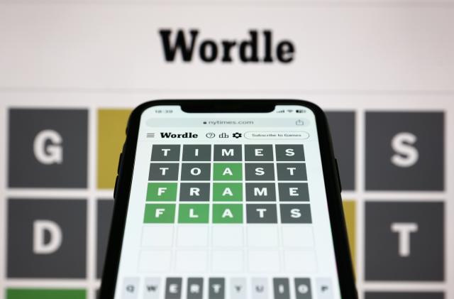 Wordle game displayed on a screen and Wordle game displayed on a phone screen are seen in this illustration photo taken in Krakow, Poland on July 20, 2023. (Photo by Jakub Porzycki/NurPhoto via Getty Images)