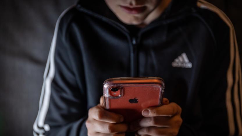 BATH, UNITED KINGDOM - MARCH 16: A 12-year-old boy looks at a smartphone screen on March 16, 2023 in Bath, England. Following the lead of the EU Commission and several US administrations, TikTok is set to be banned from UK government phones amid security concerns around the Chinese-owned video app. Recently TikTok announced that every account belonging to a user below age 18 have a 60-minute daily screen time limit automatically set. (Photo by Matt Cardy/Getty Images)