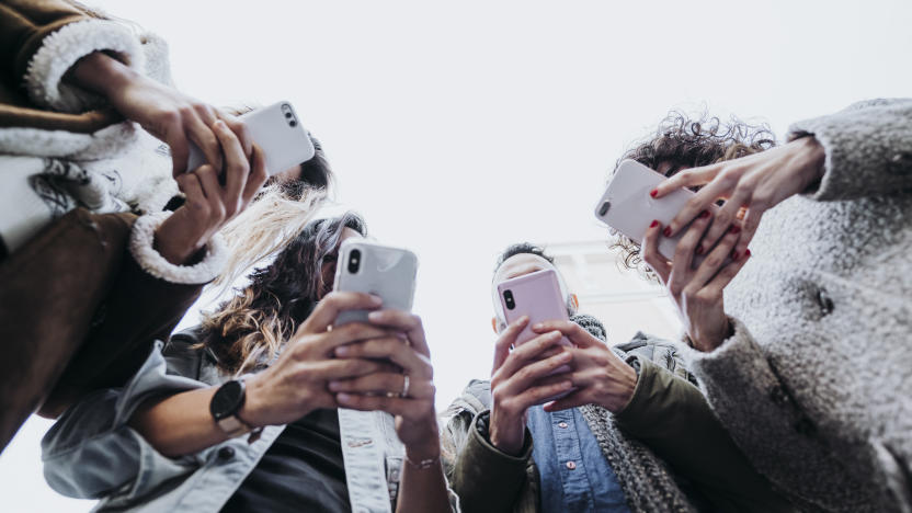 Group of friends in the street with smartphone