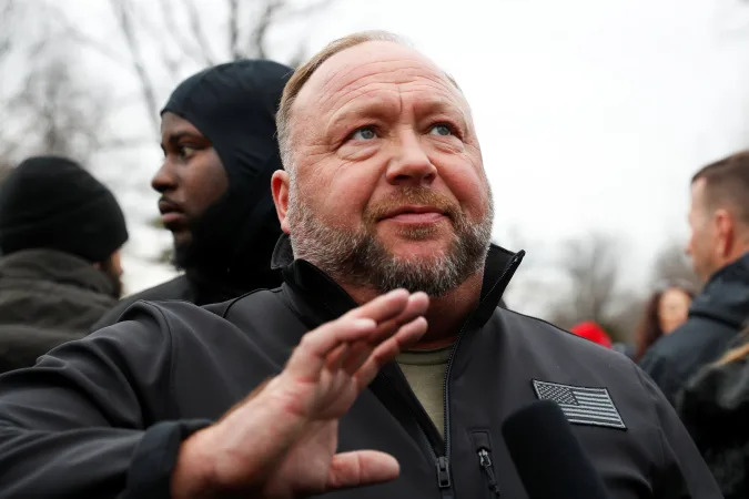 Right-wing radio talk show host Alex Jones speaks as supporters of U.S. President Donald Trump gather in front of the Supreme Court ahead of the U.S. Congress certification of the November 2020 election results during protests in Washington, U.S., January 5, 2021. REUTERS/Shannon Stapleton