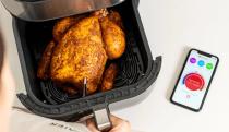 Meater Plus smart thermometer used to check internal heat of a chicken.