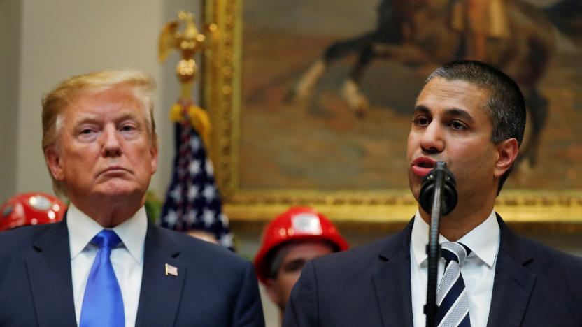 U.S. President Donald Trump looks on as Federal Communications Commission (FCC)  Commissioner Ajit Pai speaks about on United States 5G deployment in the Roosevelt Room of the White House in Washington, U.S., April 12, 2019. REUTERS/Carlos Barria