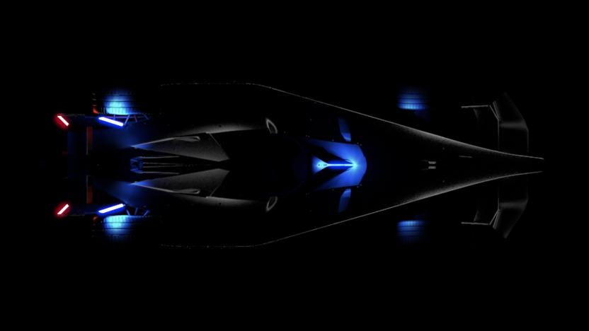 A teaser image of the Formula E Gen3 race car, showing the vehicle from above, lit only by a few onboard indicators.