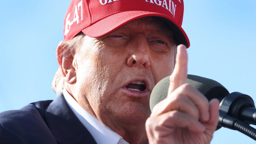 Photo of bloodied Trump fist pumping immediately spotlighted by his allies