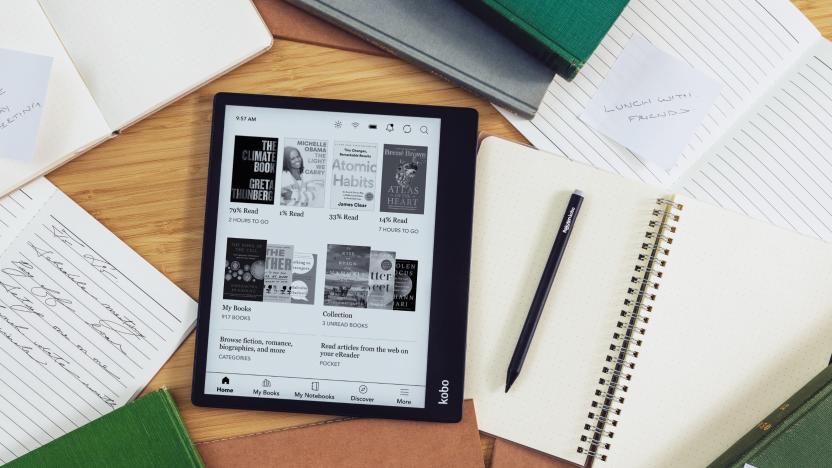 The Kobo Elipsa 2E e-reader on a desk (seen from above), surrounded by its stylus, notebooks and papers. On its screen is a reading library.