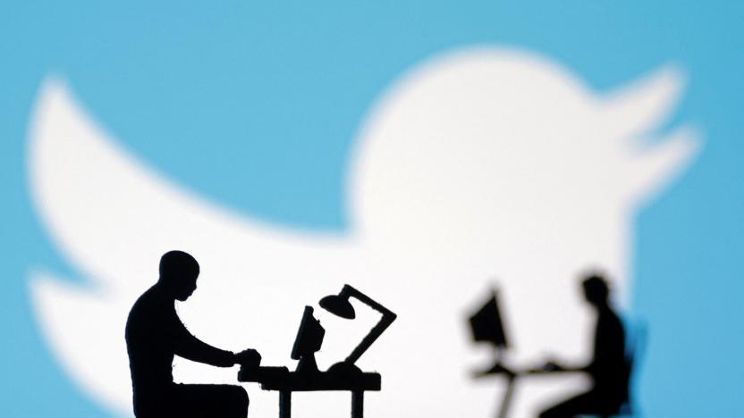 Figurines with computers and smartphones are seen in front of Twitter logo in this illustration, July 24, 2022. REUTERS/Dado Ruvic/Illustration