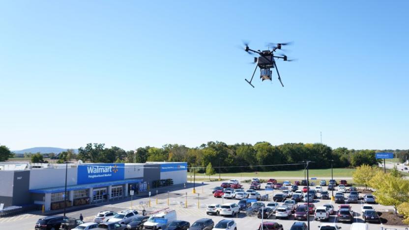 Walmart DroneUp delivery drone flying above the parking lot of one of the company's stores. 