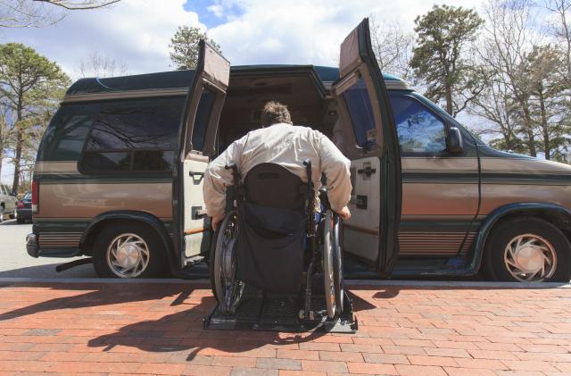 Man with Spinal Cord Injury entering his accessible van