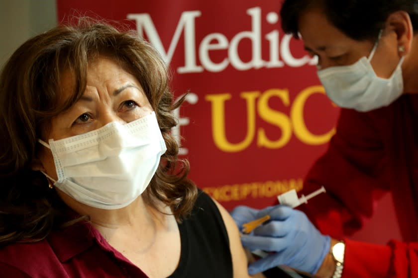 In a stab at equity, L.A. hospital vaccinates older relatives of housekeeping staff