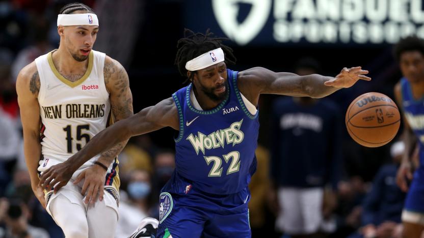 Jan 11, 2022; New Orleans, Louisiana, USA; Minnesota Timberwolves guard Patrick Beverley (22) loses the ball after colliding with New Orleans Pelicans guard Jose Alvarado (15) in the second half  at the Smoothie King Center. Mandatory Credit: Chuck Cook-USA TODAY Sports