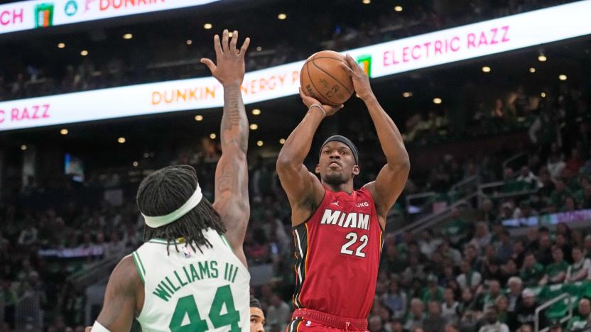 Miami Heat forward Jimmy Butler (22) shoots against Boston Celtics center Robert Williams III (44) in the first half of game 1 of the NBA basketball Eastern Conference finals playoff series in Boston, Wednesday, May 17, 2023. 