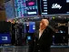 Dow ekes out another record at end of winning week for stocks