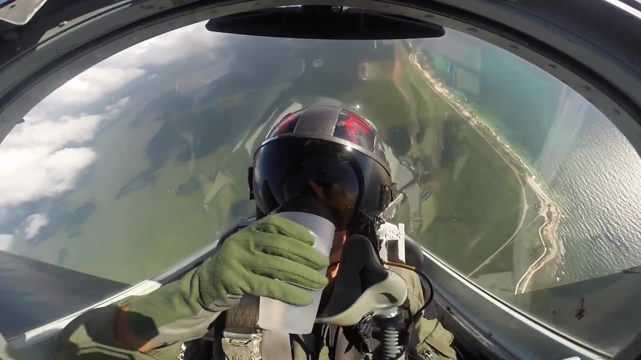 Fighter Pilot Drinks Water While Doing Barrel Rolls in a High Flying Jet
