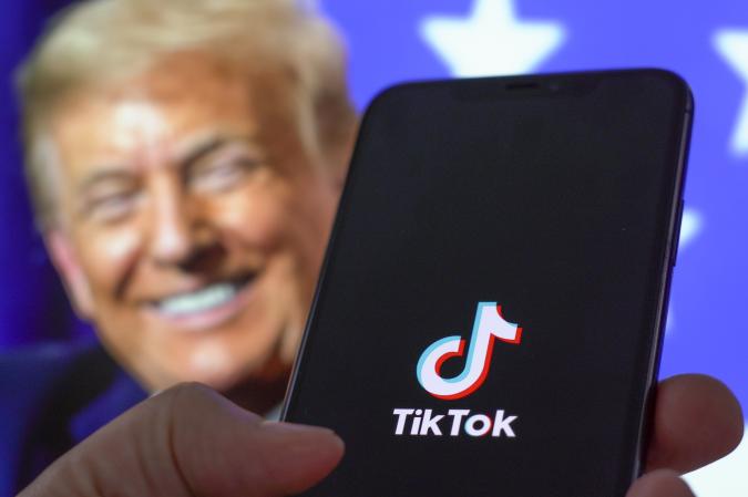 The TikTok application is seen on an iPhone 11 Pro max in this photo illustration in Warsaw, Poland on September 30, 2020. The TikTok app will be banned from US app stores from Sunday unless president Donald Trump approves a last-minute deal between US tech firm Oracle and TikTok owner ByteDance. US authorities say the Chinese video sharing app threaten national security and could pass on user data to China. (Photo Illustration by Jaap Arriens/NurPhoto via Getty Images)