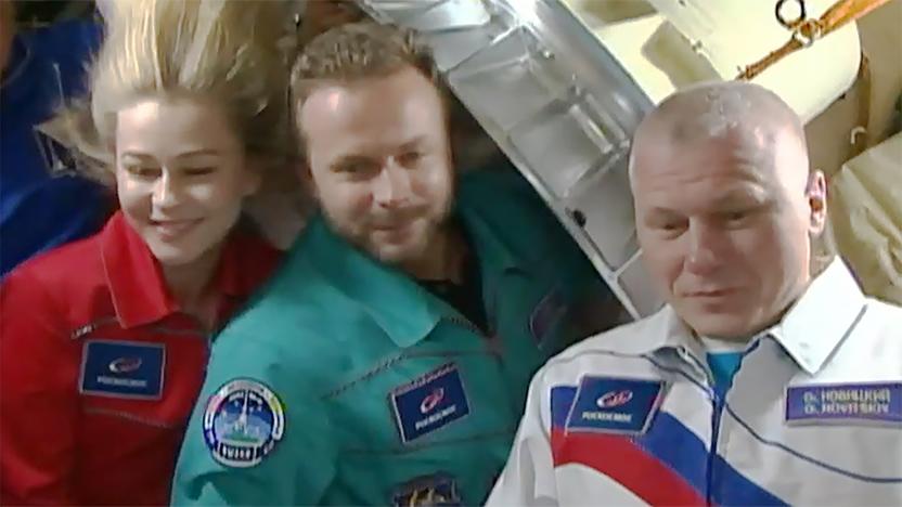 Russian filmmakers Yulia Pereslid and Klim Shipenko alongside cosmonaut Oleg Novitskiy as they returned from the ISS