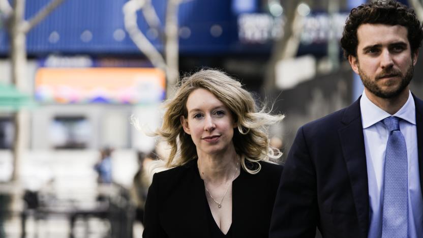 SAN JOSE, CA - MARCH 17: Former Theranos CEO Elizabeth Holmes alongside her boyfriend Billy Evans, walks back to her hotel following a hearing at the Robert E. Peckham U.S. Courthouse on March 17, 2023 in San Jose, California. Holmes appeared in court for a restitution hearing. (Photo by Philip Pacheco/Getty Images)