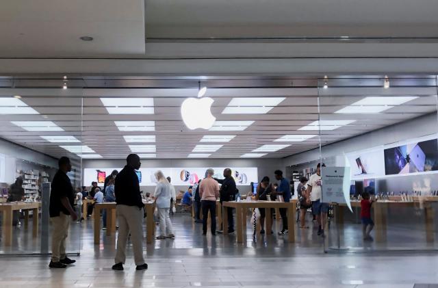 People visit the Apple store at the Cumberland Mall in Atlanta, Georgia, U.S., May 3, 2022. REUTERS/Alyssa Pointer