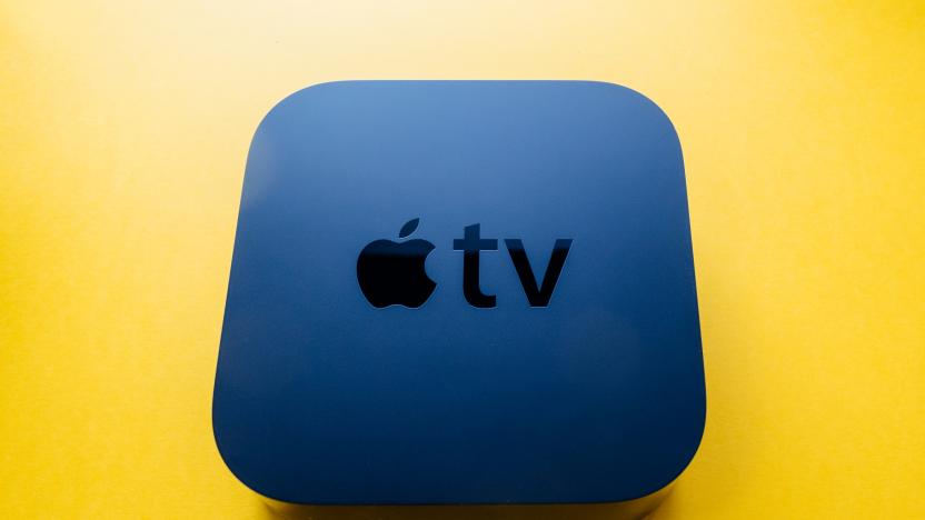 Paris, France - Nov 16, 2018: View from above at new black Apple TV 4K media streaming by Apple Computers  against yellow background - tilt-shift lens used