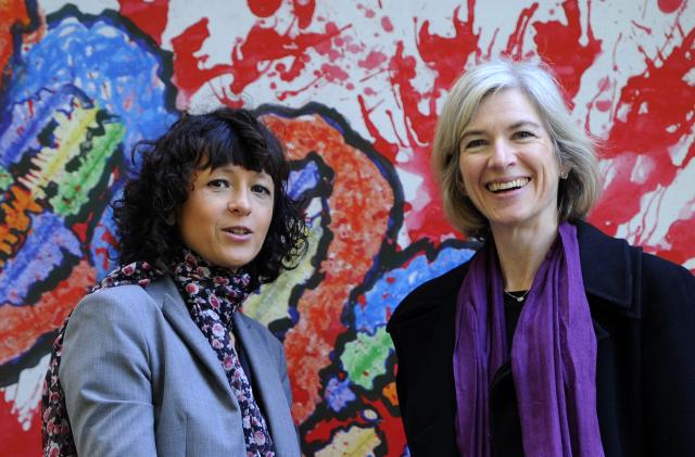 French researcher in Microbiology, Genetics and Biochemistry Emmanuelle Charpentier (L) and US  professor of Chemistry and of Molecular and Cell Biology, Jennifer Doudna posse beside a painting  made by children of the genoma at the San Francisco park in Oviedo, on October 21, 2015. Charpentier and Doudna have been awarded the 2015 Princess of Asturias Award for technical and scientific research.. AFP PHOTO/ MIGUEL RIOPA / AFP / MIGUEL RIOPA        (Photo credit should read MIGUEL RIOPA/AFP via Getty Images)