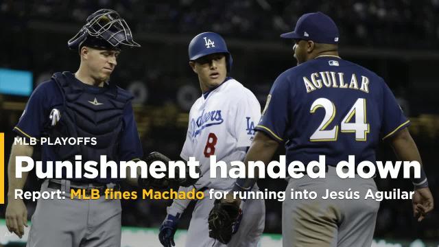 MLB fines Dodgers' Machado for running into Brewers' Aguilar