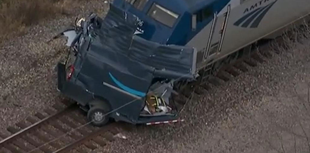 Train slices Amazon delivery truck in two