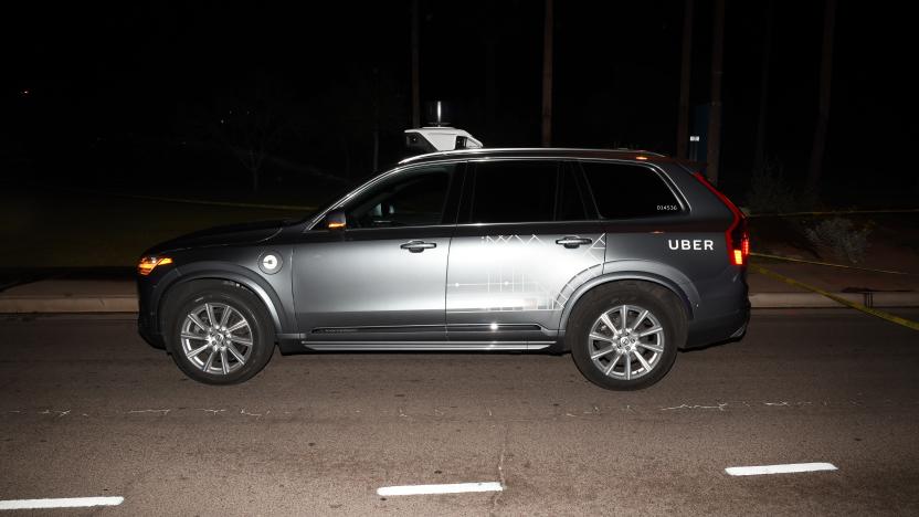 FILE - This file photo provided by the Tempe Police Department shows an Uber SUV after hitting a woman on March 18, 2018, in Tempe, Ariz. Nearly eight months after one of its autonomous test vehicles hit and killed an Arizona pedestrian, Uber wants to resume testing on public roads. The company has filed an application with the Pennsylvania Department of Transportation to test in Pittsburgh, and it has issued a lengthy safety report pledging to put two human backup drivers in each vehicle and take a raft of other precautions to make the vehicles safe. Company officials acknowledge they have a long way to go to regain public trust after the March 18 crash in Tempe, Arizona, that killed Elaine Herzberg, as she crossed a darkened road outside the lines of a crosswalk. (Tempe Police Department via AP, File)