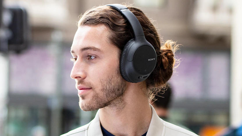 A person wearing Sony's WH-CH710N headphones.