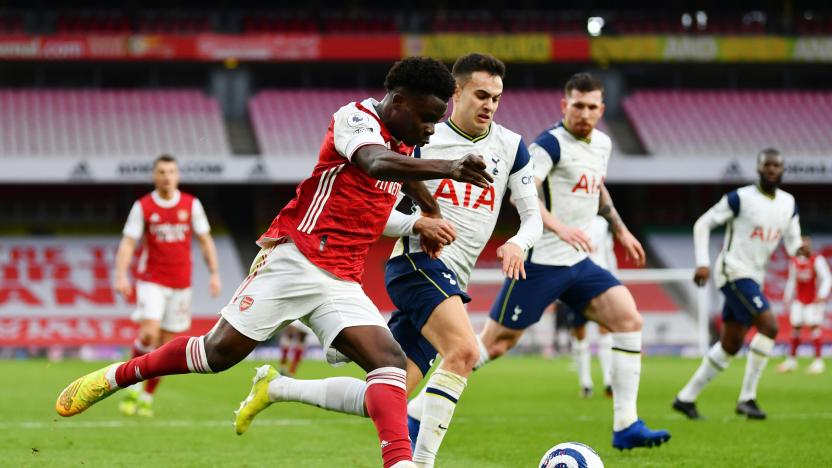 Soccer Football - Premier League - Arsenal v Tottenham Hotspur - Emirates Stadium, London, Britain - March 14, 2021 Arsenal's Bukayo Saka in action with Tottenham Hotspur's Sergio Reguilon Pool via REUTERS/Dan Mullan EDITORIAL USE ONLY. No use with unauthorized audio, video, data, fixture lists, club/league logos or 'live' services. Online in-match use limited to 75 images, no video emulation. No use in betting, games or single club /league/player publications.  Please contact your account representative for further details.