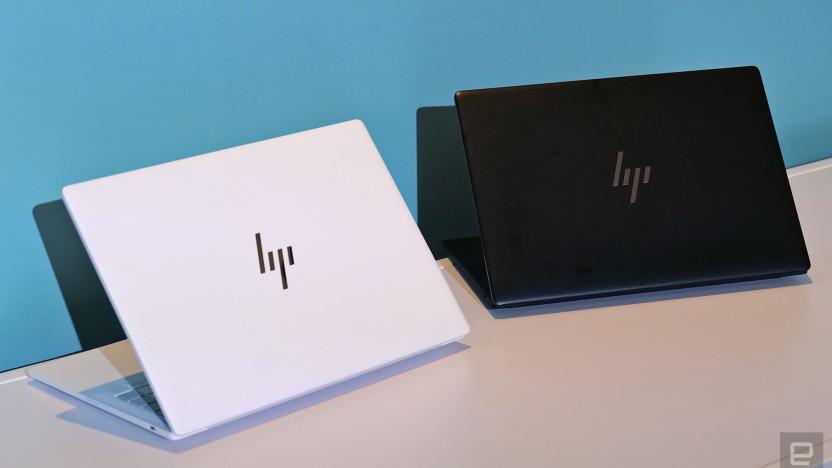 A white and black HP Dragonfly Pro next to each other, with their lids facing front.