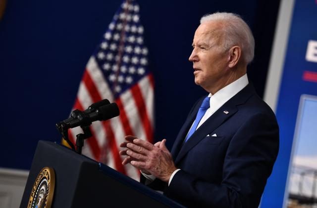 US President Joe Biden speaks about how the Bipartisan Infrastructure Law will rebuild the US and the progress made since he signed the bill into law, in the South Court Auditorium of the White House in Washington, DC, on January 14, 2022. (Photo by Brendan Smialowski / AFP) (Photo by BRENDAN SMIALOWSKI/AFP via Getty Images)