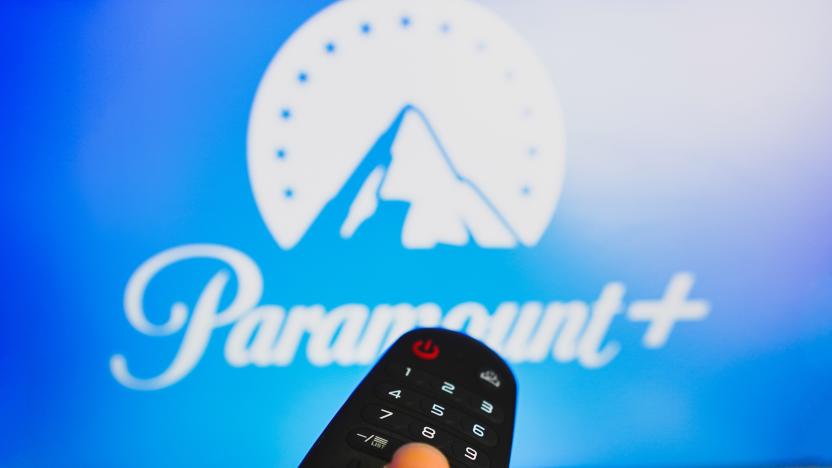 BRAZIL - 2022/05/10: In this photo illustration, a hand holding a TV remote control in front of the Paramount Plus logo on a TV screen. (Photo Illustration by Rafael Henrique/SOPA Images/LightRocket via Getty Images)