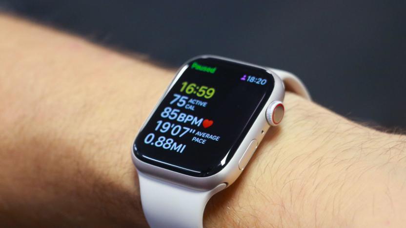 The Apple Watch Series 8 on a person's wrist, showing a paused workout tracking screen.