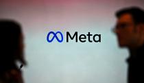 Visitors stand in front of a Meta logo during a launch event at the corporate offices of Meta in Berlin on June 6, 2023. (Photo by Tobias SCHWARZ / AFP) (Photo by TOBIAS SCHWARZ/AFP via Getty Images)