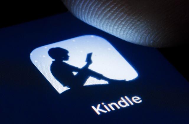 BERLIN, GERMANY - APRIL 22: The logo of Amazon E-Book reader Kindle is shown on the display of a smartphone on April 22, 2020 in Berlin, Germany. (Photo by Thomas Trutschel/Photothek via Getty Images)