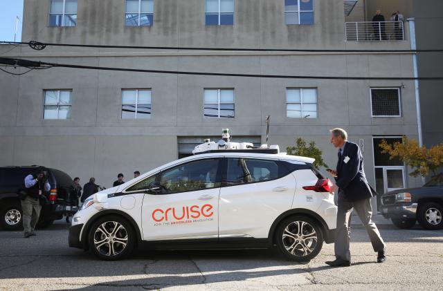 A journalist gets in a self-driving GM Bolt EV during a media event in San Francisco, California, U.S. November 28, 2017. REUTERS/Elijah Nouvelage