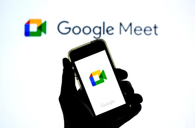 SPAIN - 2021/04/20: In this photo illustration a Google Meet app in seen displayed on a smartphone with the Google Meet logo in the background. (Photo Illustration by Thiago Prudencio/SOPA Images/LightRocket via Getty Images)